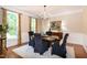 Elegant dining room with hardwood floors, chandelier, and wainscoting at 9136 Palm Bay Cir, Raleigh, NC 27617