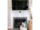 Elegant fireplace with decorative mantel and accents creates a cozy focal point in the living space at 9136 Palm Bay Cir, Raleigh, NC 27617