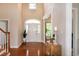 Bright foyer features a soaring ceiling, hardwood floors, and ample natural light through the front door at 9136 Palm Bay Cir, Raleigh, NC 27617