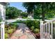 Decorative stone walkway leading to a home, lined with lush landscaping, creating an inviting entrance at 9136 Palm Bay Cir, Raleigh, NC 27617