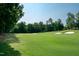 Expansive golf course view with sand traps and lush green fairway at 9136 Palm Bay Cir, Raleigh, NC 27617