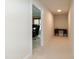 Hallway leads to office featuring desk and woven shades at 9136 Palm Bay Cir, Raleigh, NC 27617