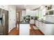 Well-lit kitchen with white cabinets, stainless steel appliances, and center island perfect for meal preparation at 9136 Palm Bay Cir, Raleigh, NC 27617