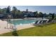 Community swimming pool with rows of lounge chairs, perfect for relaxation and enjoying sunny days at 9136 Palm Bay Cir, Raleigh, NC 27617