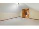 View of attic space showing door and connection to finished room at 9257 Sauls Rd, Raleigh, NC 27603