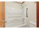 Bathroom area featuring a white shower and bathtub combo at 9257 Sauls Rd, Raleigh, NC 27603