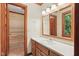 Bathroom showcasing a vanity with a sink, medicine cabinet, and a view to the adjoining shower at 9257 Sauls Rd, Raleigh, NC 27603