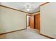 Bedroom with carpet, ceiling fan, wooden trim and a closet at 9257 Sauls Rd, Raleigh, NC 27603