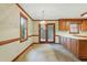 Bright dining area featuring wood trim, neutral walls, carpeted floor, and a hanging light fixture at 9257 Sauls Rd, Raleigh, NC 27603