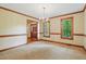 Spacious dining room with elegant chandelier, trim, and natural light at 9257 Sauls Rd, Raleigh, NC 27603