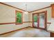 Dining room with a chandelier, natural light, and backyard access at 9257 Sauls Rd, Raleigh, NC 27603
