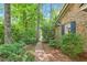 Brick home showcasing a brick walkway and lush landscaping at 9257 Sauls Rd, Raleigh, NC 27603