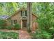 Charming brick home with a brick walkway and inviting front door at 9257 Sauls Rd, Raleigh, NC 27603