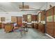 Well-lit garage with cabinets, pegboard, and garage door with windows at 9257 Sauls Rd, Raleigh, NC 27603