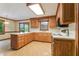 Kitchen with oak cabinets, tile floor, and modern appliances at 9257 Sauls Rd, Raleigh, NC 27603