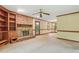 Living room features a brick fireplace, ceiling fan, and access to the outside at 9257 Sauls Rd, Raleigh, NC 27603