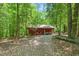 View of exterior of outbuilding with lawn equipment visible at 9257 Sauls Rd, Raleigh, NC 27603
