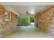 Spacious, covered brick patio with ceiling fan overlooking private backyard at 9257 Sauls Rd, Raleigh, NC 27603