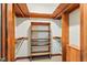 Spacious walk-in closet with exposed wood construction and shelving for organization at 9257 Sauls Rd, Raleigh, NC 27603