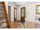 Bright foyer features hardwood floors and a decorative front door at 9507 Sertoma Rd, Chapel Hill, NC 27516