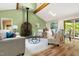 Sunlit living room with stylish furnishings and access to the outdoor deck at 9507 Sertoma Rd, Chapel Hill, NC 27516