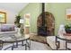Cozy living room featuring a stone fireplace and ample seating area at 9507 Sertoma Rd, Chapel Hill, NC 27516
