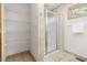 Bright and airy shower area with glass enclosure and convenient shelving at 9507 Sertoma Rd, Chapel Hill, NC 27516