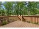 Back porch featuring wooden decking and wooden railing with a view of a grassy lawn at 95113 Vance Knls, Chapel Hill, NC 27517