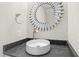 Chic bathroom featuring a vessel sink, silver faucet, and striking sunburst mirror at 95113 Vance Knls, Chapel Hill, NC 27517