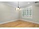 Dining room with hardwood floors, plantation shutters, and contemporary lighting at 95113 Vance Knls, Chapel Hill, NC 27517