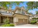 Two-story home featuring stone accents, a two-car garage, and mature trees at 95113 Vance Knls, Chapel Hill, NC 27517