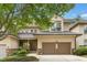 Charming two-story home with stone accents, attached two car garage, and manicured landscaping at 95113 Vance Knls, Chapel Hill, NC 27517
