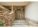 Inviting entryway featuring stone accents, flagstone steps, and a covered porch at 95113 Vance Knls, Chapel Hill, NC 27517