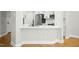 Bright kitchen bar with modern appliances and wood flooring, perfect for entertaining at 95113 Vance Knls, Chapel Hill, NC 27517