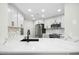 Modern kitchen showcasing white cabinetry, chevron backsplash, and stainless steel appliances at 95113 Vance Knls, Chapel Hill, NC 27517