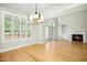 Bright living room features hardwood floors, fireplace, and lots of natural light at 95113 Vance Knls, Chapel Hill, NC 27517
