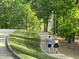 Scenic walking path winding through lush green landscaping. This home offers a picturesque outdoor lifestyle at 95113 Vance Knls, Chapel Hill, NC 27517
