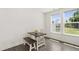 Cozy dining area with table, bench, and a window overlooking a scenic view at 97 Begonia St, Angier, NC 27501