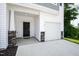 Front exterior of a townhome with a one car garage and covered entry at 97 Begonia St, Angier, NC 27501