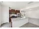 Modern kitchen featuring granite counters, wood cabinets, and stainless steel appliances at 97 Begonia St, Angier, NC 27501