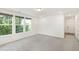 Bright living room with plush carpet and large windows providing ample natural light at 97 Begonia St, Angier, NC 27501