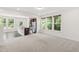 Open concept living space with a kitchen featuring granite countertops and stainless appliances at 97 Begonia St, Angier, NC 27501