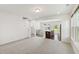 Open-concept living space with kitchen island, dining area, and lots of natural light at 97 Begonia St, Angier, NC 27501