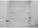 Clean white bathtub with shower in a bright bathroom at 98 Priming Way, Angier, NC 27501