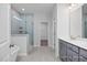Modern bathroom featuring a separate tub, walk-in shower, and dual sink vanity at 98 Priming Way, Angier, NC 27501