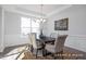 Bright dining room with chandelier, hardwood floors and lots of natural light at 98 Priming Way, Angier, NC 27501