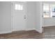 Entryway showcasing stylish flooring and a glimpse into a sunlit room at 98 Priming Way, Angier, NC 27501