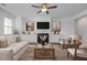 Spacious living room featuring a fireplace, built-in cabinets, and neutral decor at 98 Priming Way, Angier, NC 27501