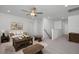 Bright living room with neutral tones, ceiling fan, modern furniture, and stylish decor at 98 Priming Way, Angier, NC 27501