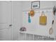 Functional mudroom with built-in storage, hooks, and a bench at 98 Priming Way, Angier, NC 27501